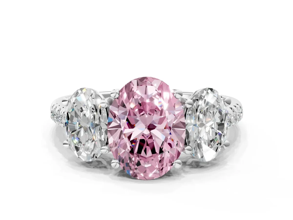 Fancy Pink Three-Stone Oval Cut Diamond Ring with Round Pavé Band and Prong Setting White gold