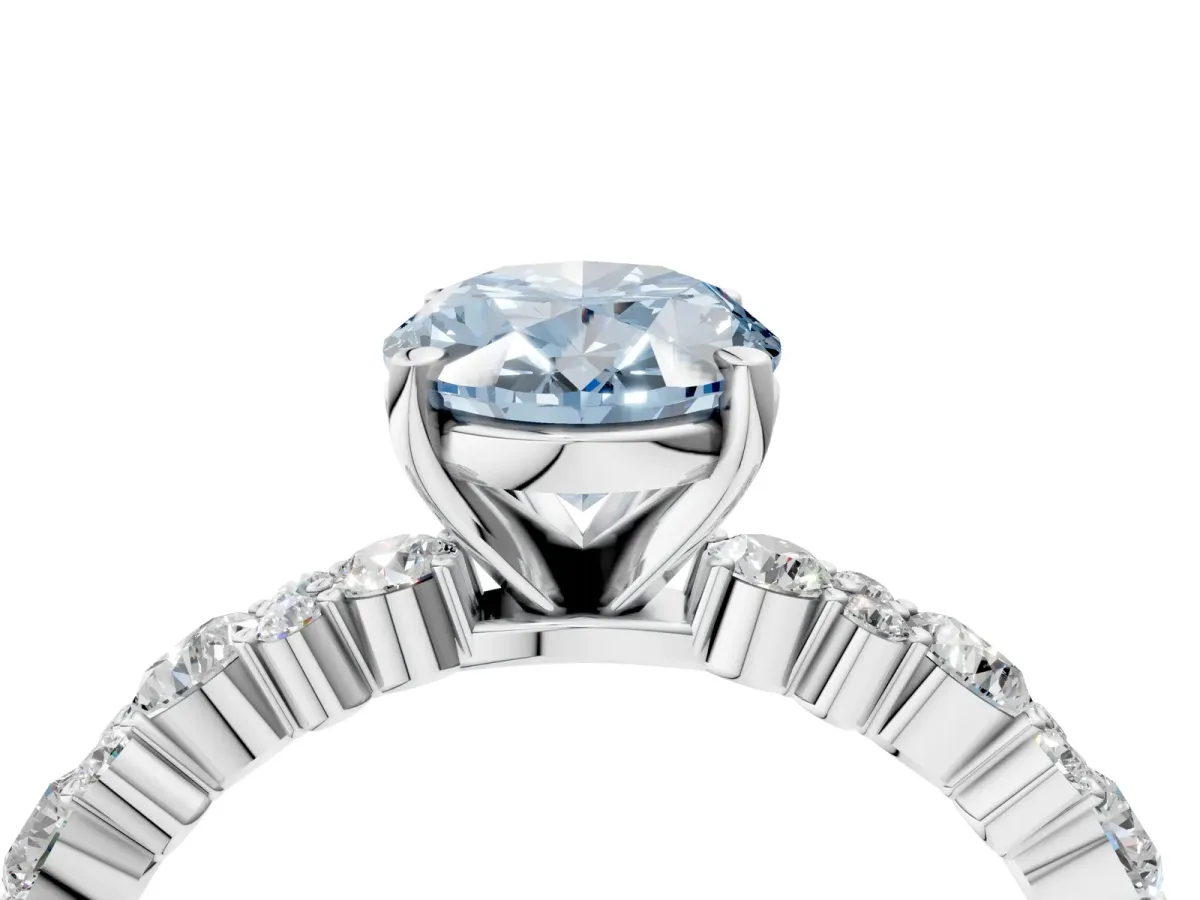Fancy Blue Oval Cut Diamond Side Stone Solitaire Ring with Round and Four-Prong Setting Platinum
