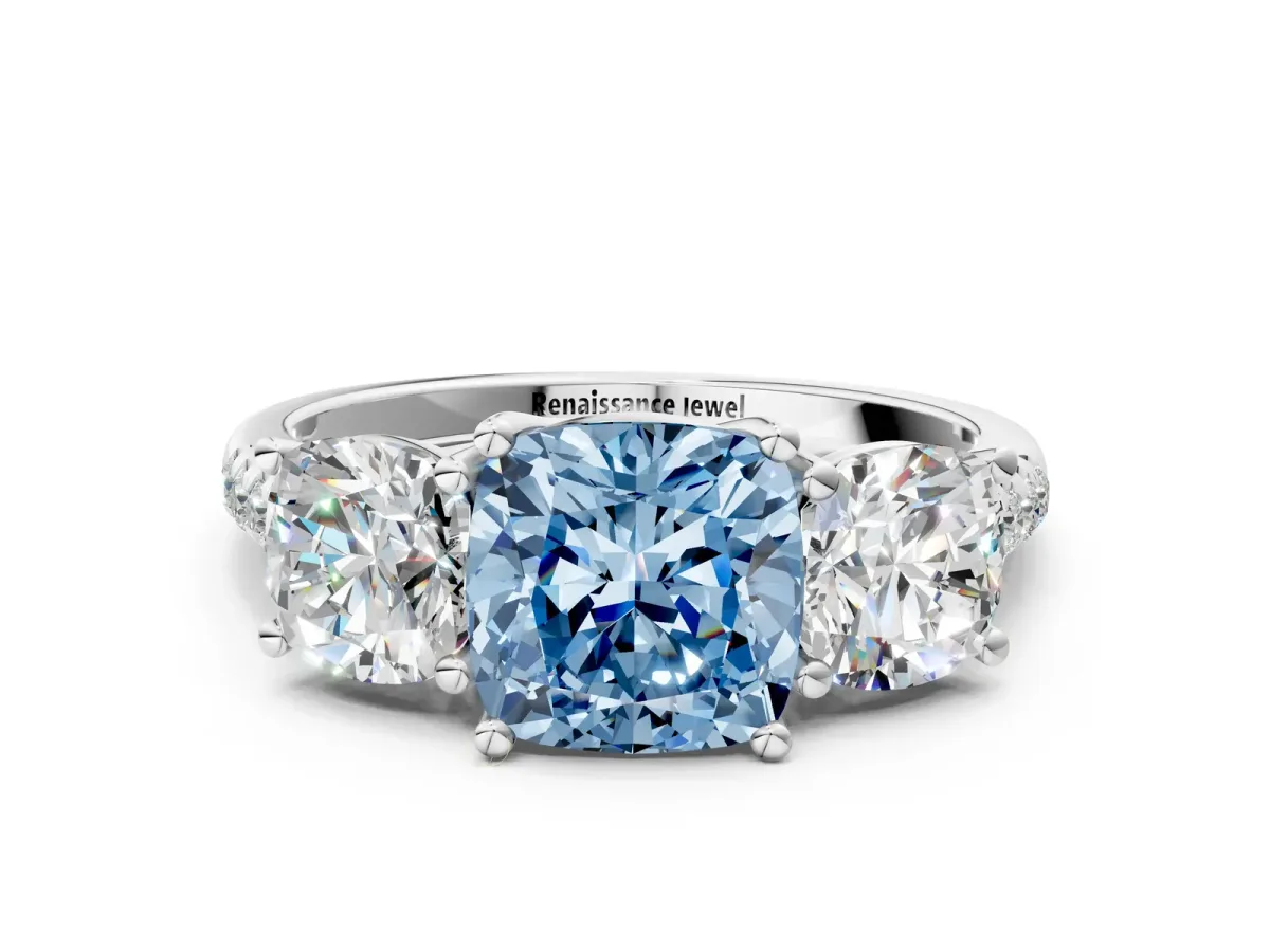 Fancy Blue Three-Stone Cushion Cut Diamond Ring with Round Pavé Band and Prong Setting White gold