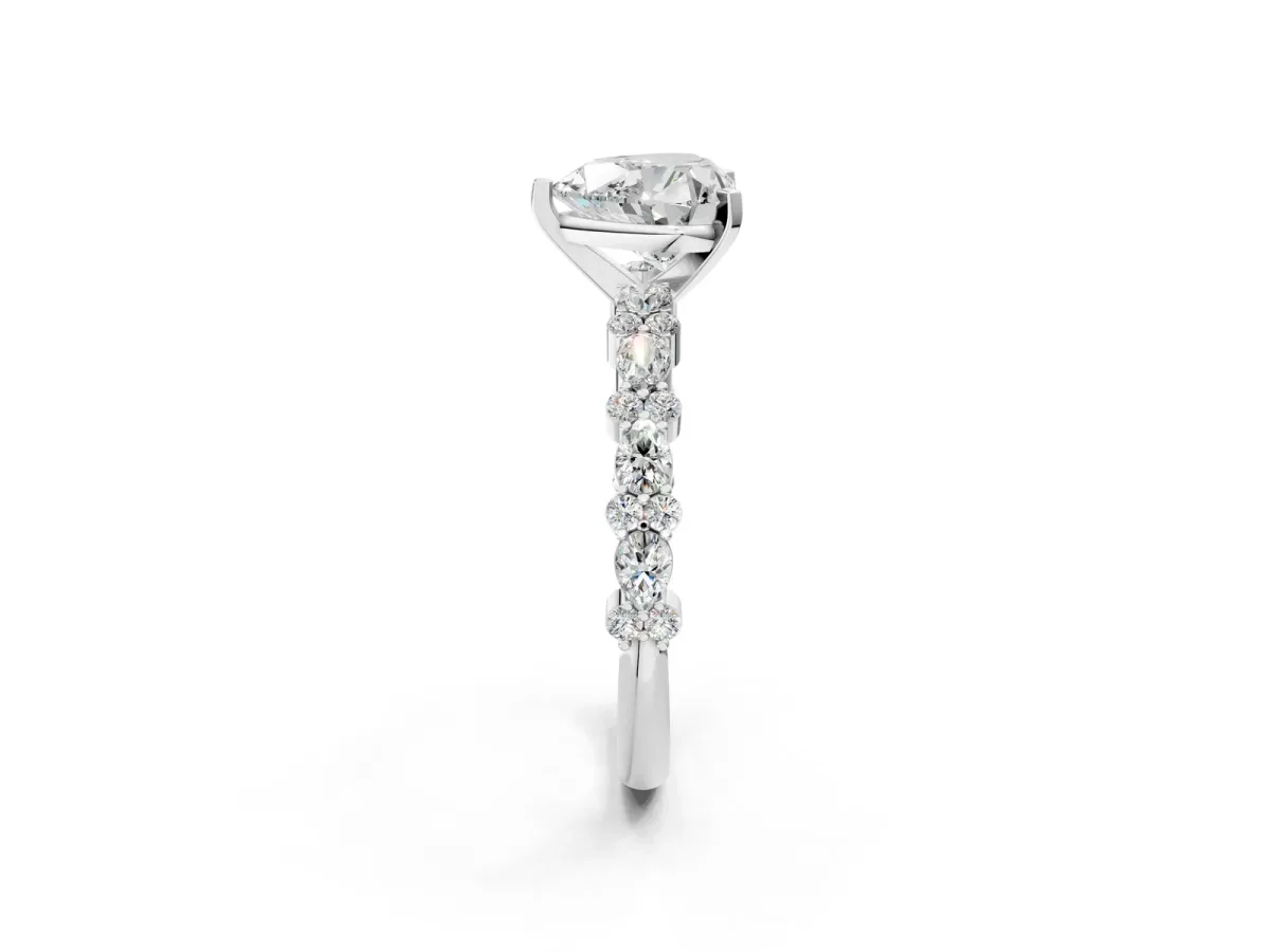 Heart Cut Diamond Side Stone Solitaire Ring with Round and Four-Prong Setting Platinum