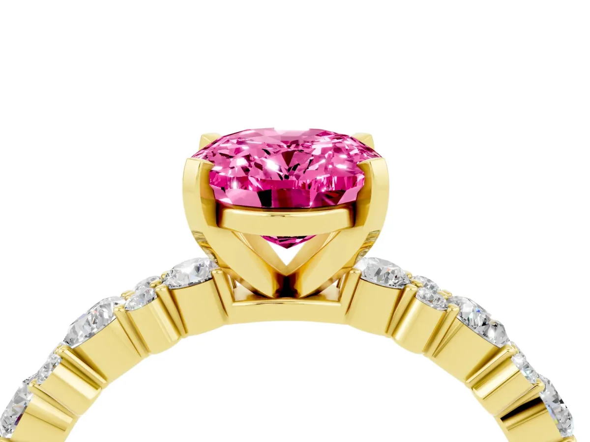 Oval Cut Pink Sapphire Side Stone Solitaire Ring with Round and Four-Prong Setting Yellow gold
