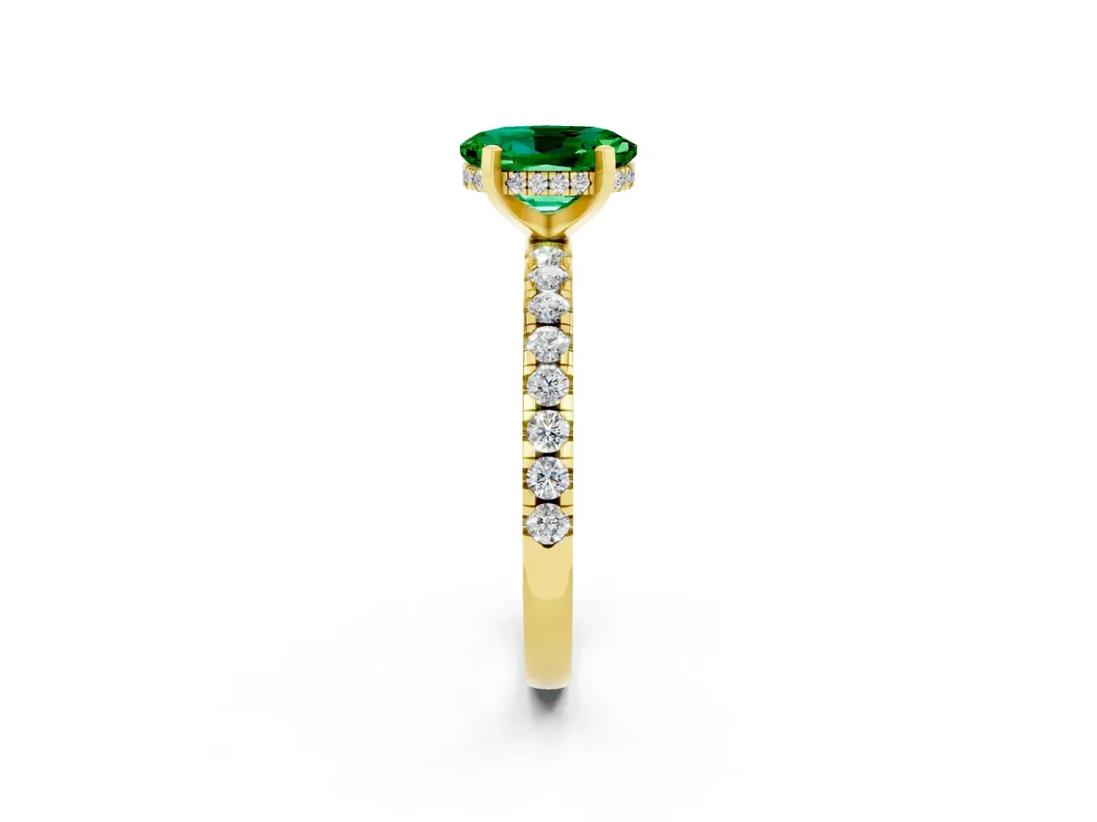 Oval Cut Emerald Solitaire Ring with Round Pavé Band and Four-Prong Setting Yellow gold