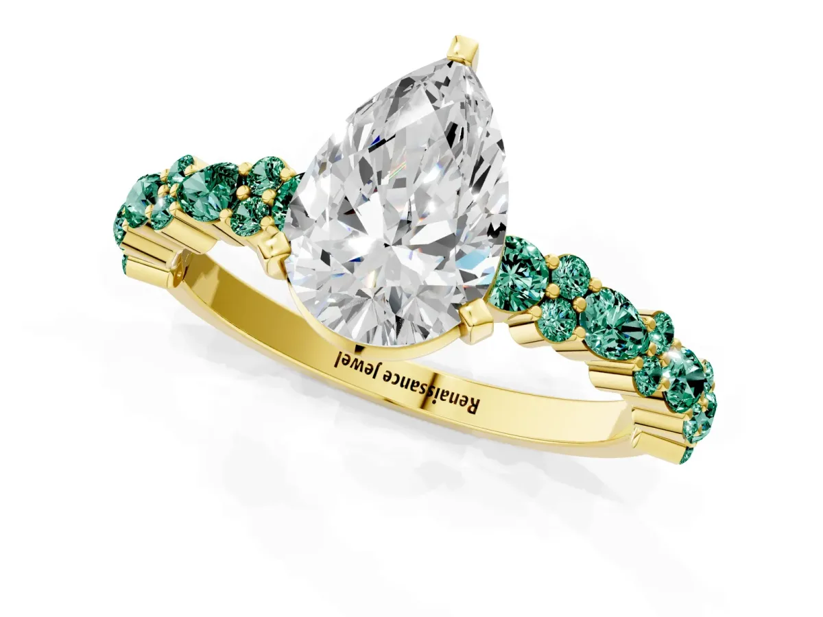 Pear Cut Diamond Side Stone Solitaire Ring with Round Green Sapphire and Four-Prong Setting Yellow gold