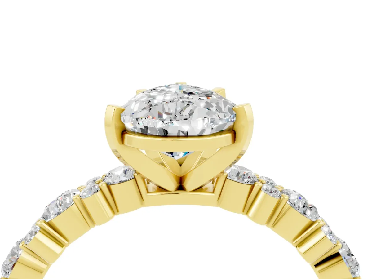 Pear Cut Moissanite Side Stone Solitaire Ring with Round and Four-Prong Setting Yellow gold