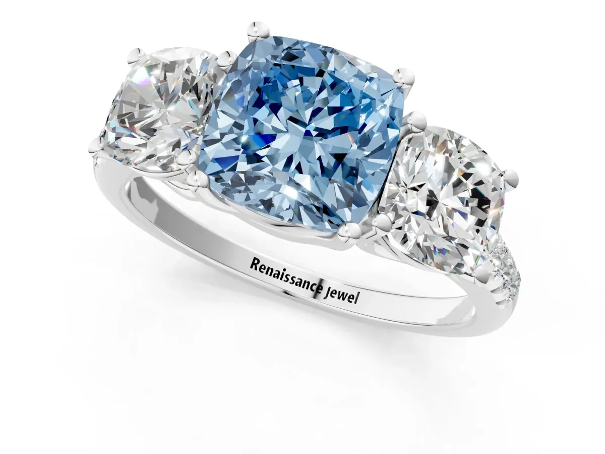 Fancy Blue Three-Stone Cushion Cut Diamond Ring with Round Pavé Band and Prong Setting White gold