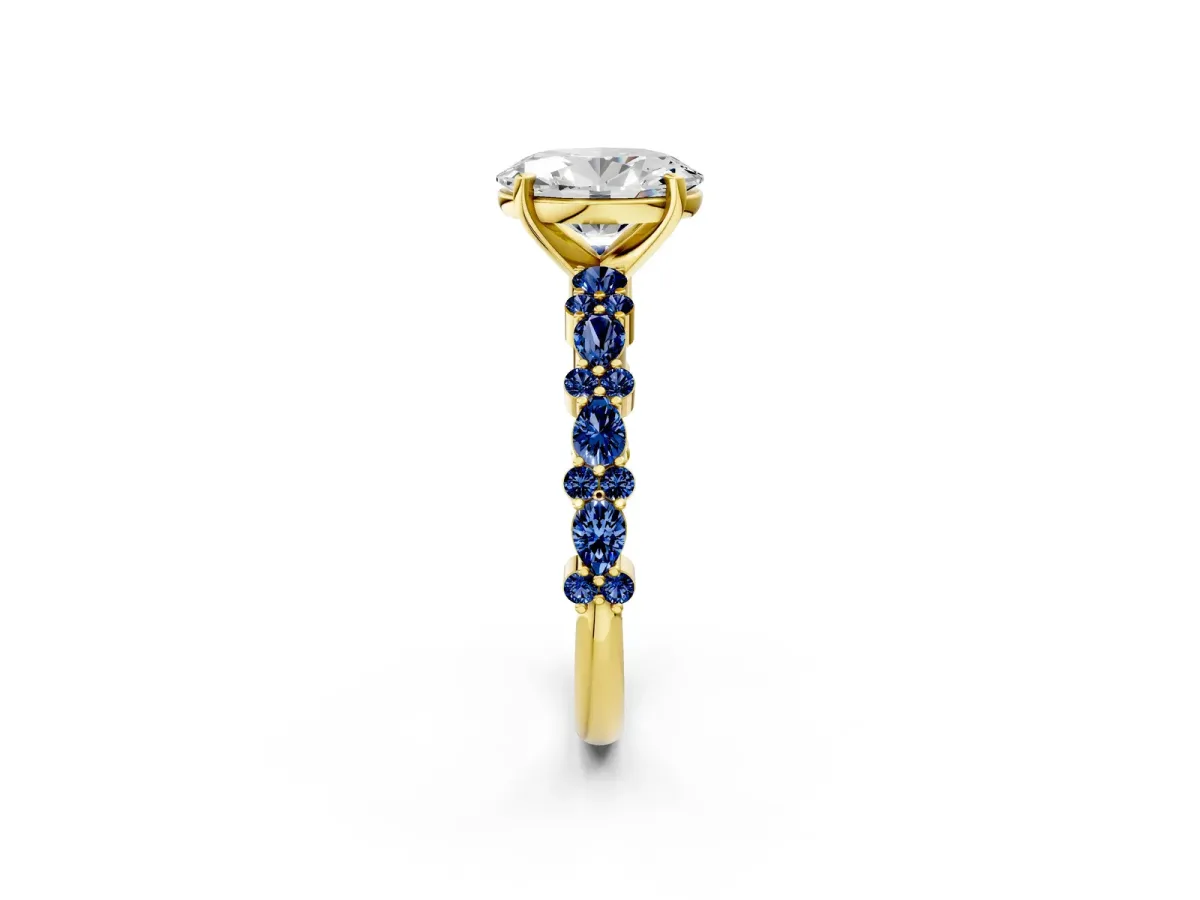 Oval Cut Diamond Side Stone Solitaire Ring with Round Blue Sapphire and Four-Prong Setting Yellow gold