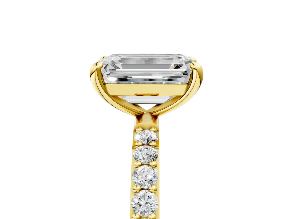 Emerald Cut Diamond Solitaire Ring with Round Moissanite Pavé Band and Prong Setting Yellow gold