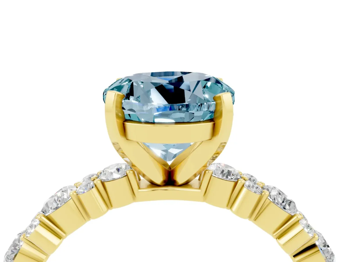 Round Cut Aquamarine Side Stone Solitaire Ring with Round and Four-Prong Setting Yellow gold