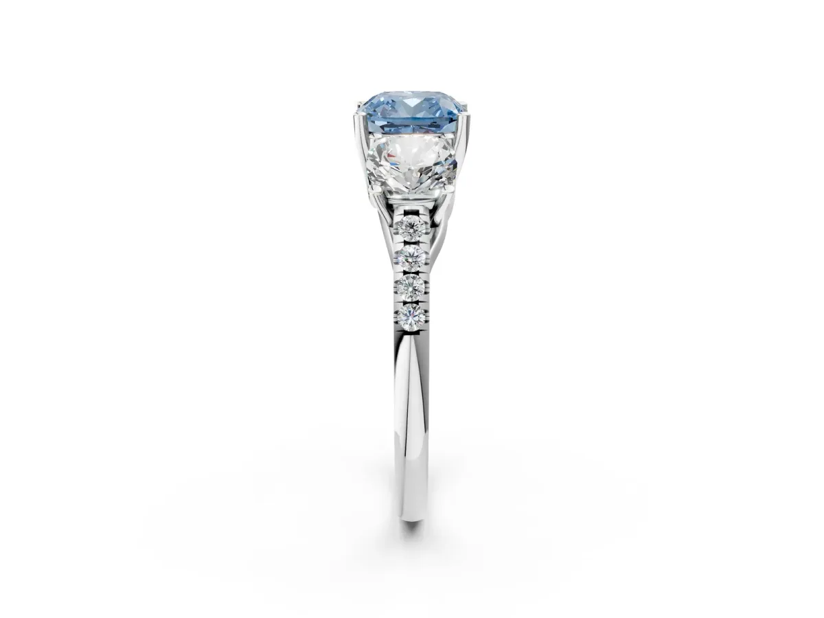 Fancy Blue Three-Stone Cushion Cut Diamond Ring with Round Pavé Band and Prong Setting White gold