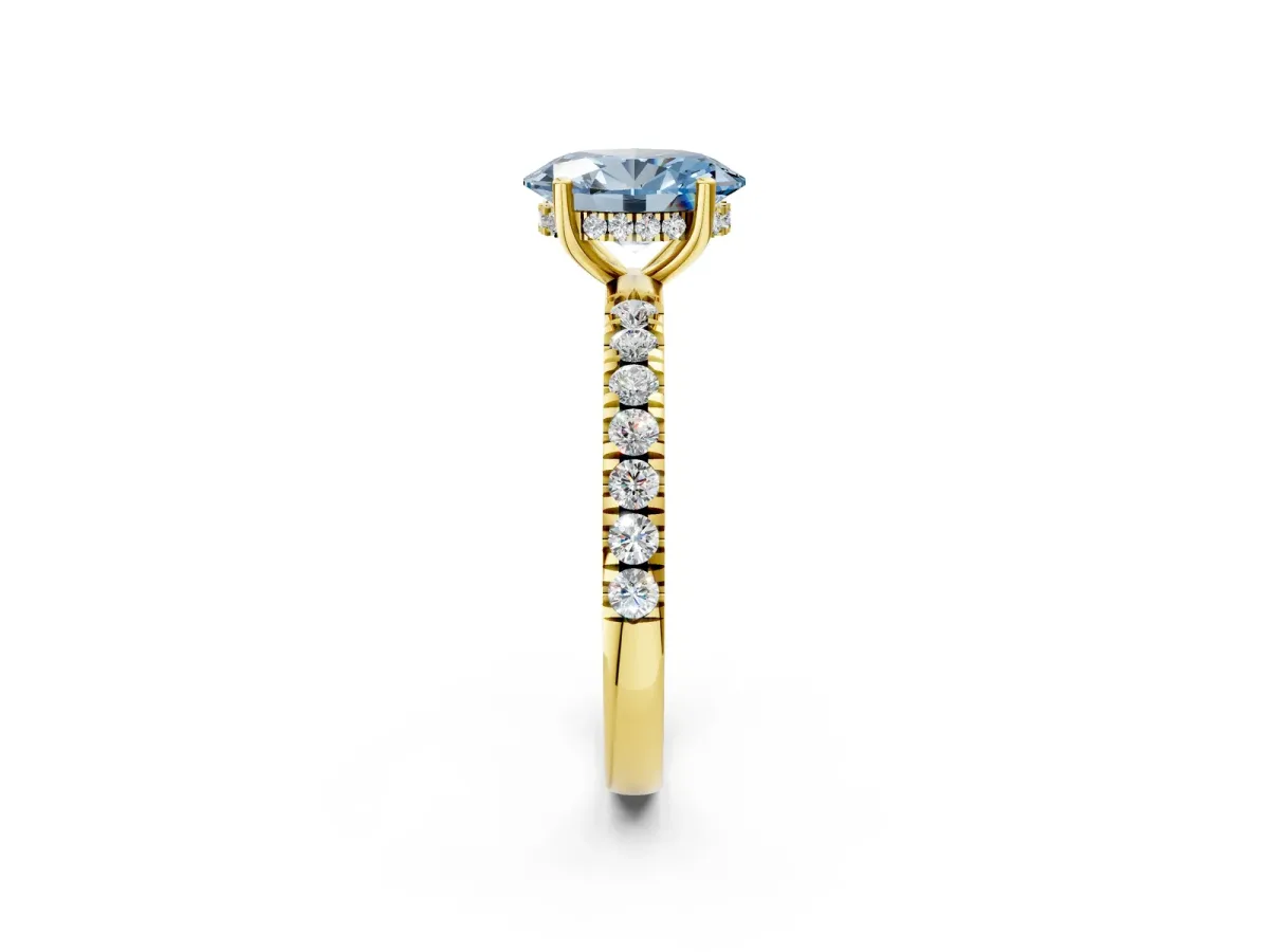 Fancy Blue Oval Cut Diamond Pave Band Solitaire Ring with Round and Prong Setting Yellow gold