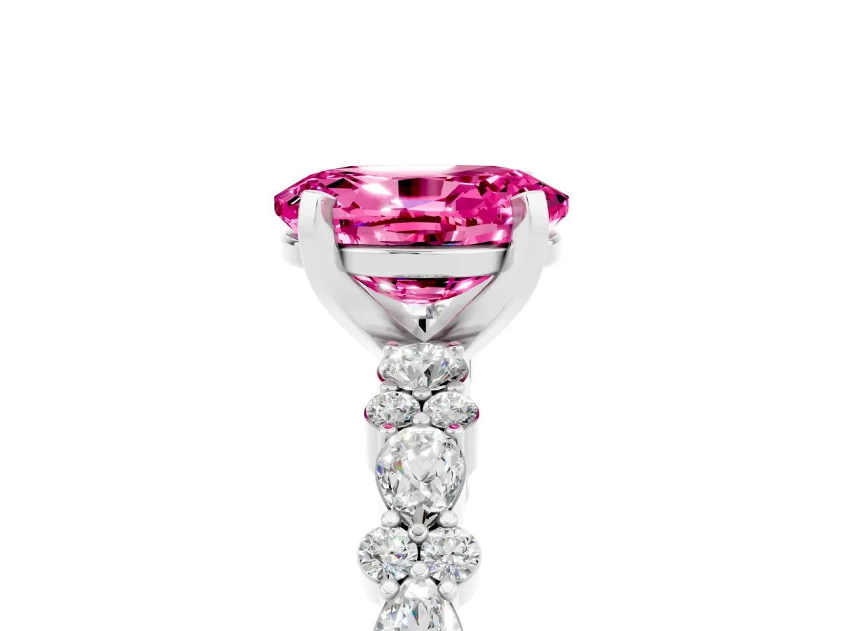 Oval Cut Pink Sapphire Side Stone Solitaire Ring with Round and Four-Prong Setting White gold