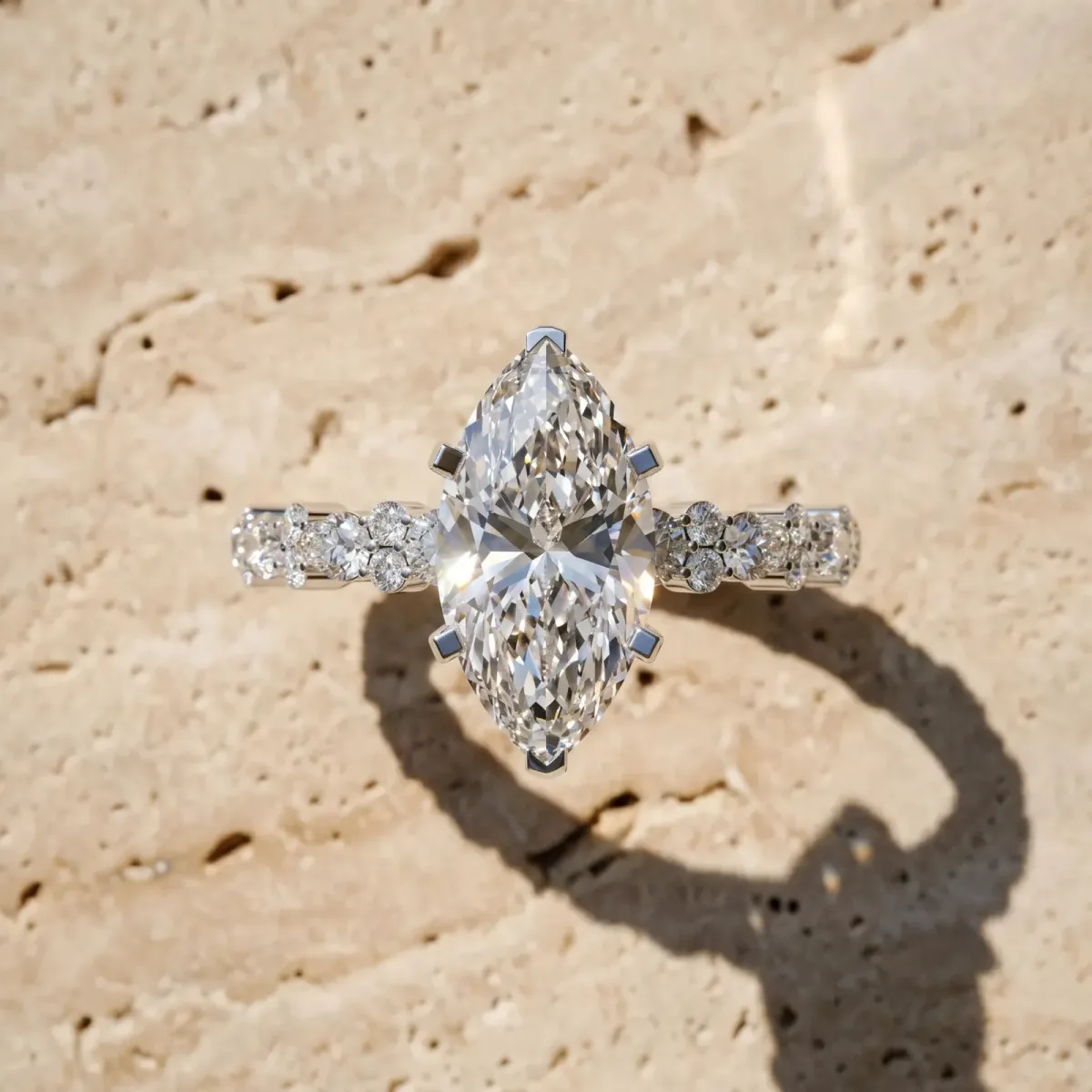 Marquise Cut Diamond Side Stone Solitaire Ring with Round and Four-Prong Setting Platinum