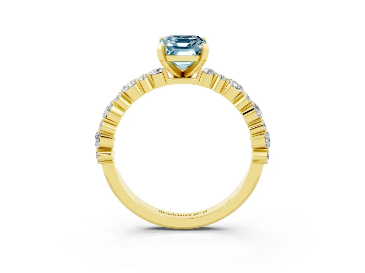 Emerald Cut Aquamarine Side Stone Solitaire Ring with Round and Four-Prong Setting Yellow gold
