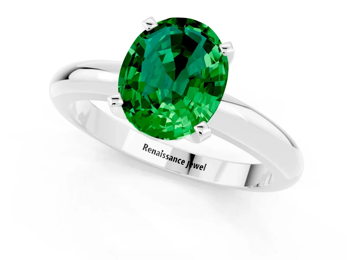 Oval Cut Emerald Solitaire Engagement Ring with Round Band and Four-Prong Setting Platinum