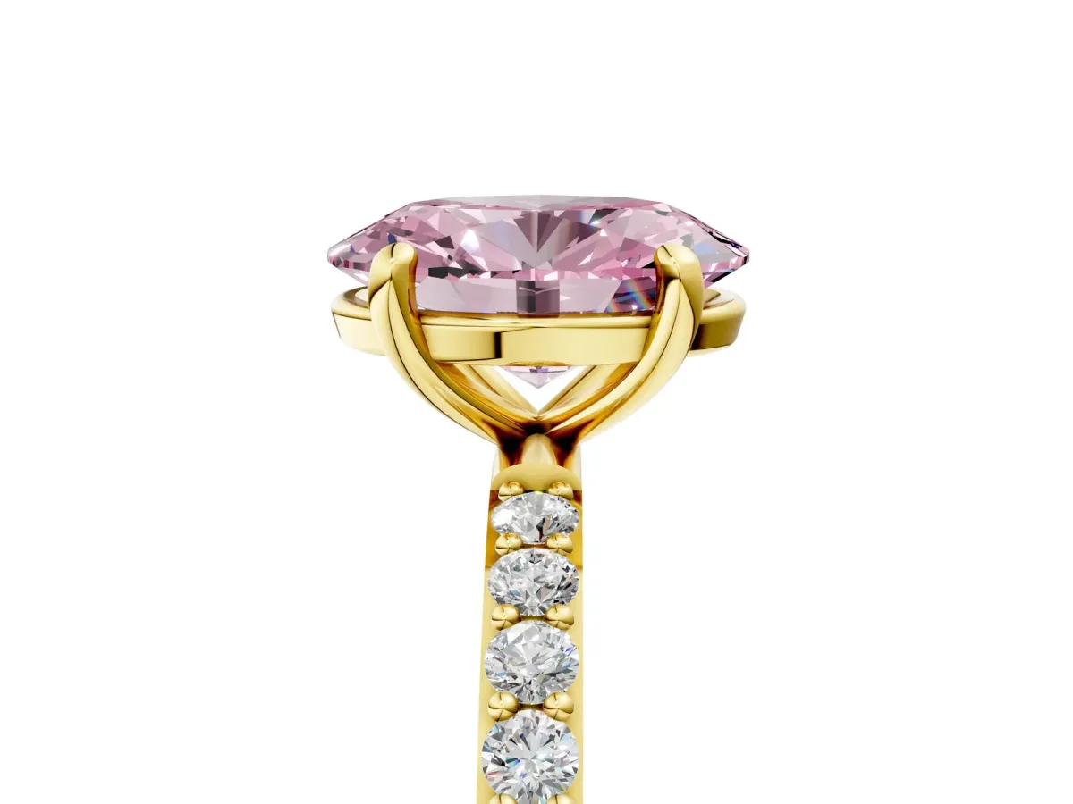 Fancy Pink Oval Cut Diamond Solitaire Ring with Round Pavé Band and Prong Setting Yellow gold
