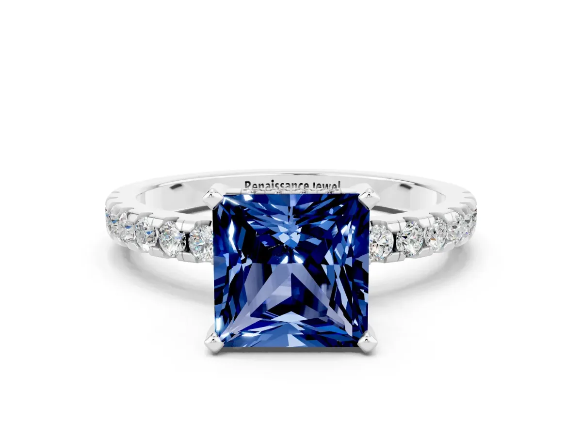 Princess Cut Blue Sapphire Solitaire Ring with Round Pavé Band and Four-Prong Setting Silver