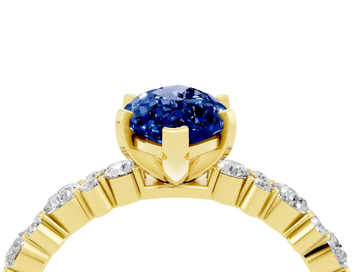 Marquise Cut Blue Sapphire Side Stone Solitaire Ring with Round and Four-Prong Setting Yellow gold