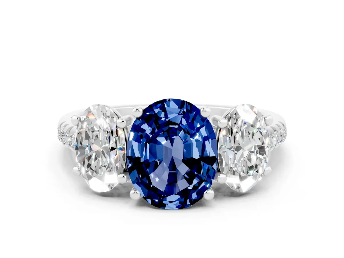 Three-Stone Oval Cut Blue Sapphire Ring with Round Pavé Band and Prong Setting Platinum