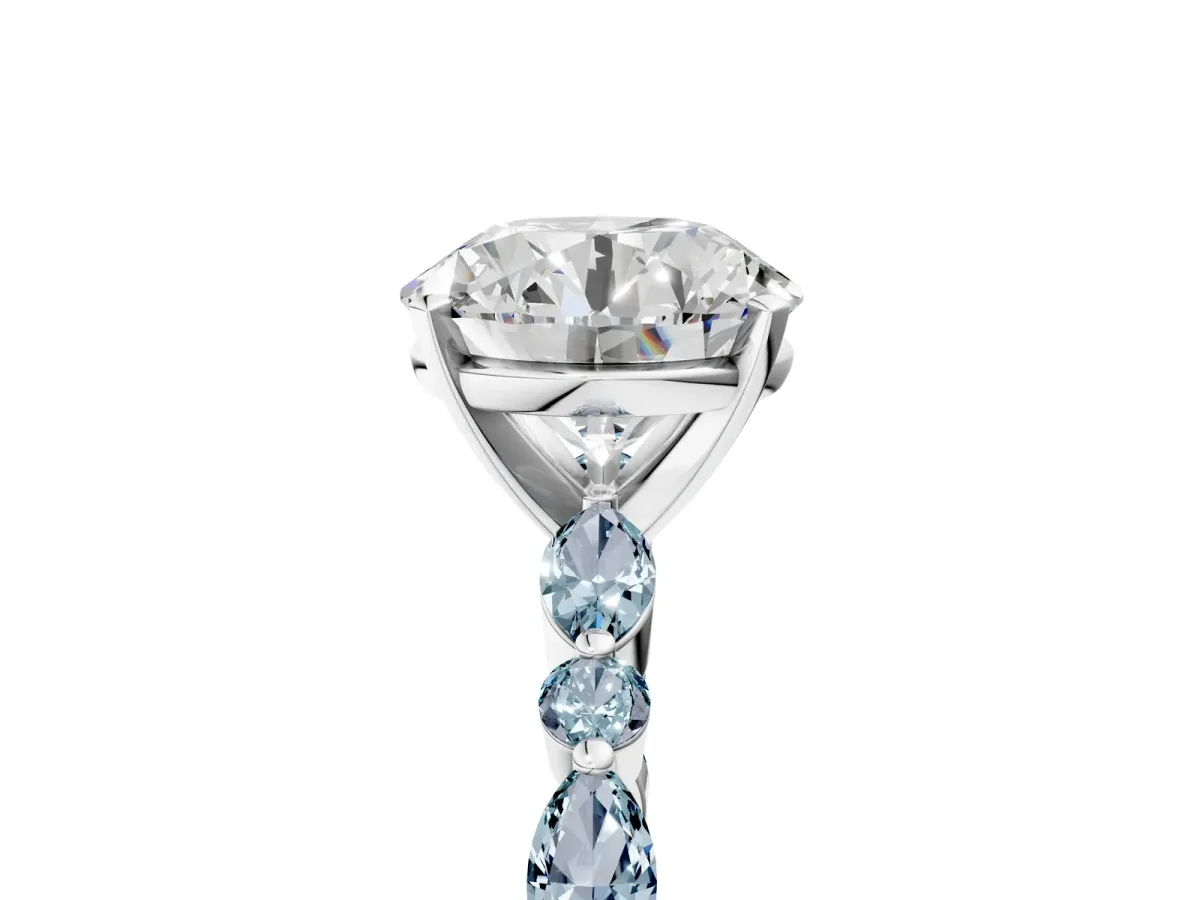 Round Cut Diamond Ring with Marquise and Round Aquamarine Side Stones and Four-Prong Setting Platinum