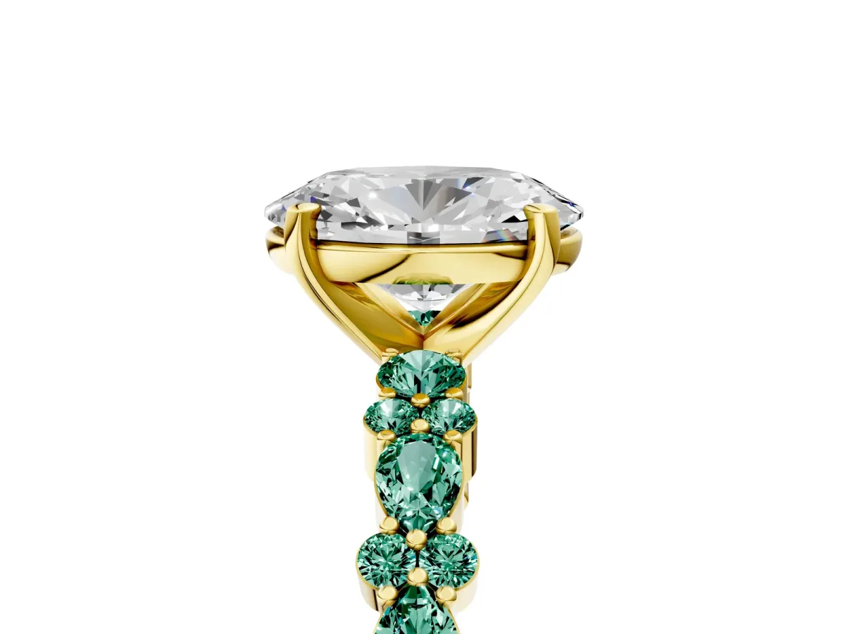 Oval Cut Diamond Side Stone Solitaire Ring with Round Green Sapphire and Four-Prong Setting Yellow gold