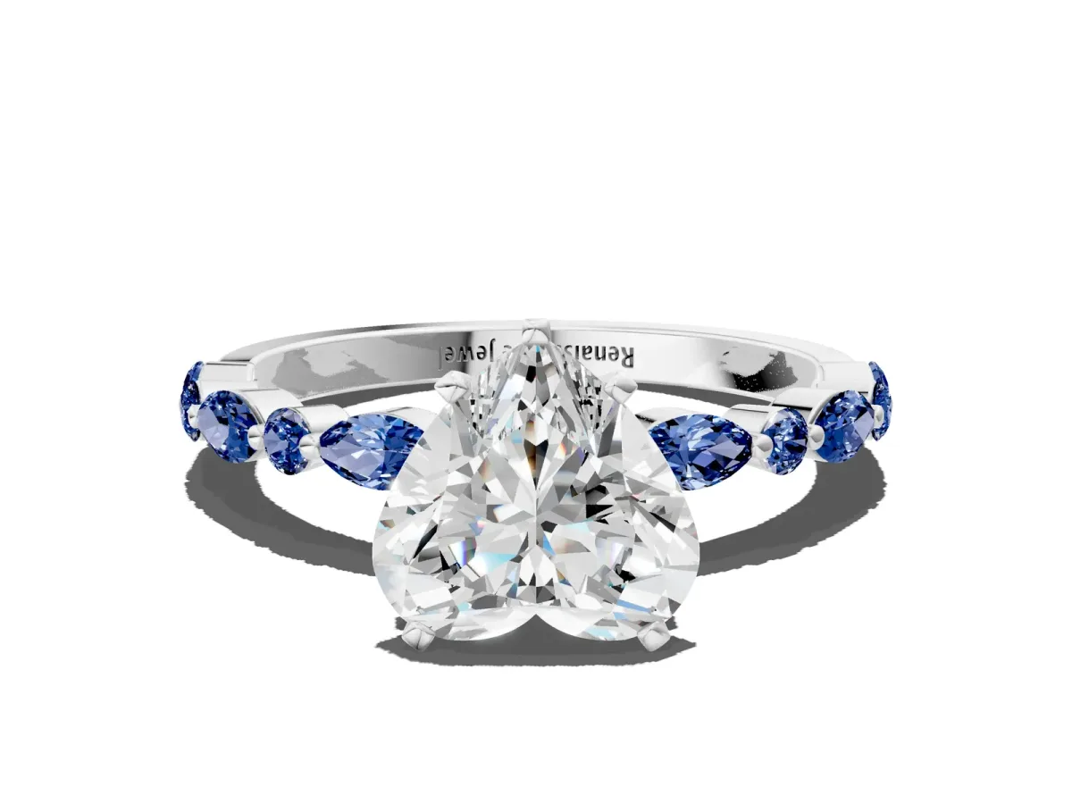 Heart Cut Diamond Ring with Marquise and Round Blue Sapphire Side Stones and Four-Prong Setting Silver