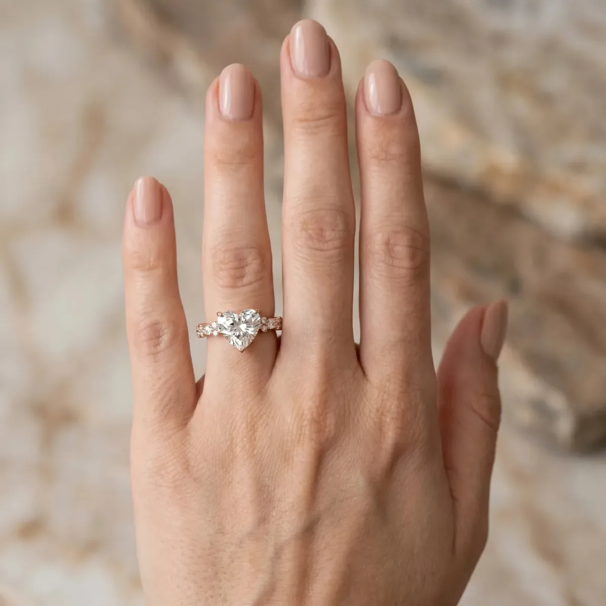 Heart Cut Diamond Side Stone Solitaire Ring with Round and Four-Prong Setting Rose gold