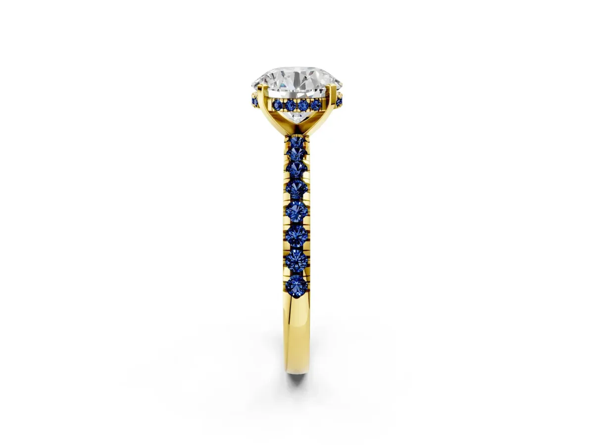 Round Cut Diamond Solitaire Ring with Round Blue Sapphire Pavé Band and Four-Prong Setting Yellow gold