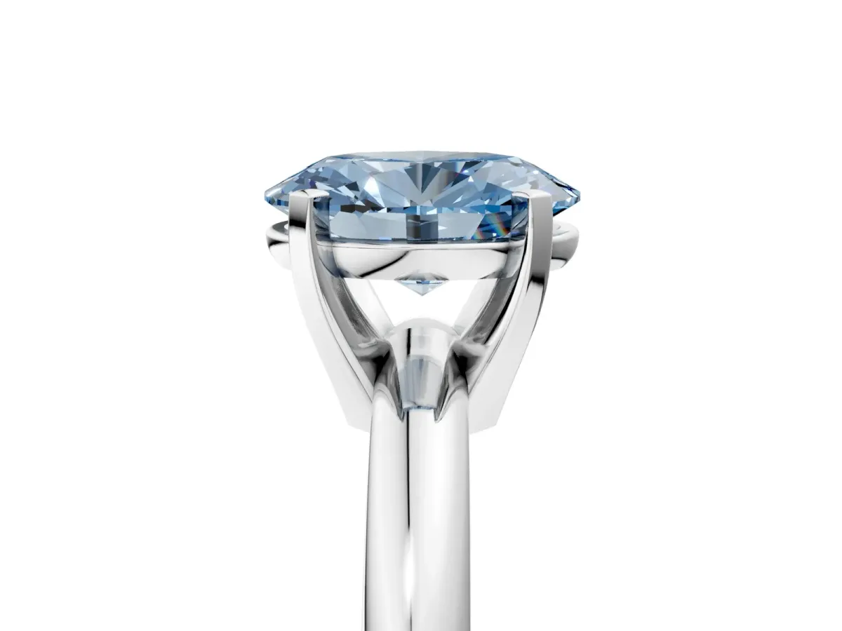 Fancy Blue Oval Cut Diamond Solitaire Engagement Ring with Round Band and Four-Prong Setting White gold