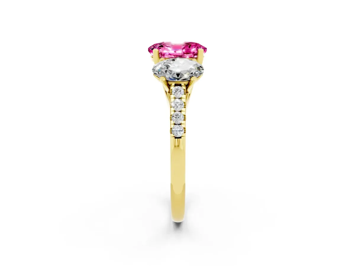 Three-Stone Oval Cut Pink Sapphire Ring with Round Pavé Band and Prong Setting Yellow gold