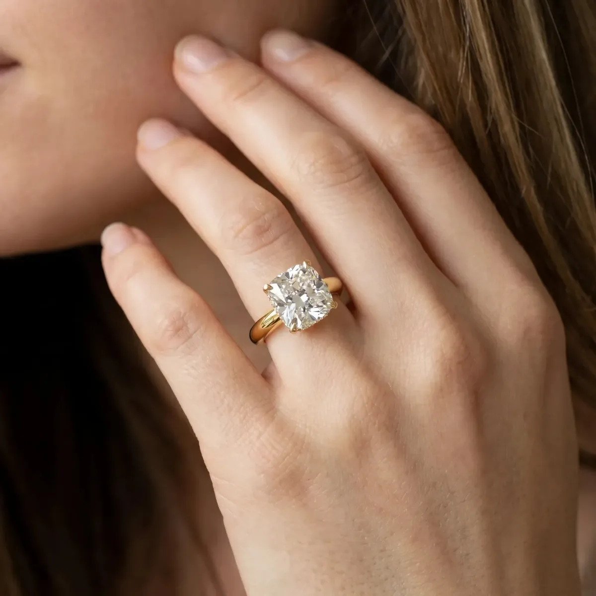 Cushion Cut Diamond Solitaire Engagement Ring with Round Band and Four-Prong Setting Yellow gold