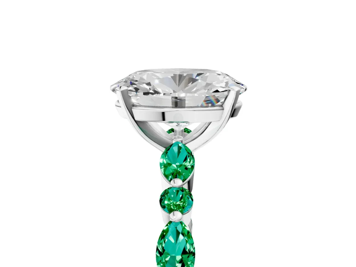Oval Cut Diamond Ring with Marquise and Round Emerald Side Stones and Four-Prong Setting White gold