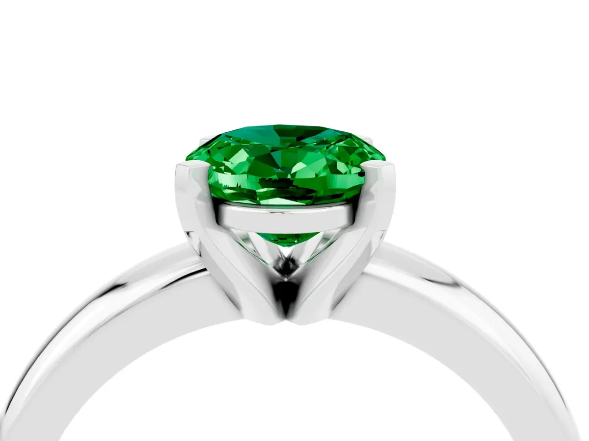Oval Cut Emerald Solitaire Engagement Ring with Round Band and Four-Prong Setting Platinum