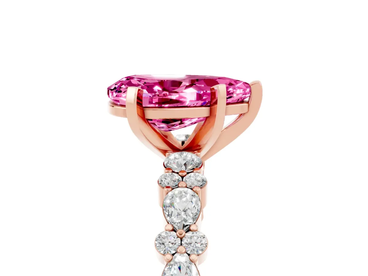 Pear Cut Pink Sapphire Side Stone Solitaire Ring with Round and Four-Prong Setting Rose gold