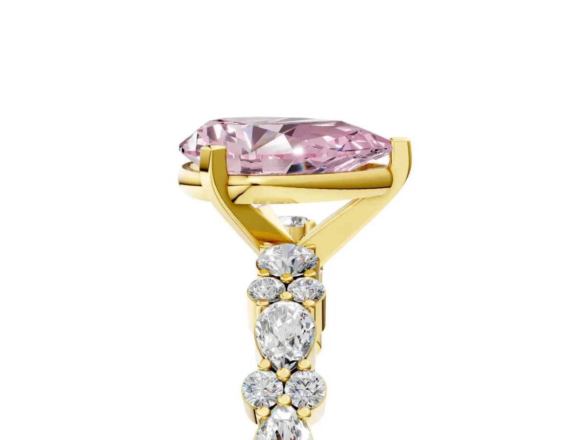Fancy Pink Pear Cut Diamond Side Stone Solitaire Ring with Round and Four-Prong Setting Yellow gold