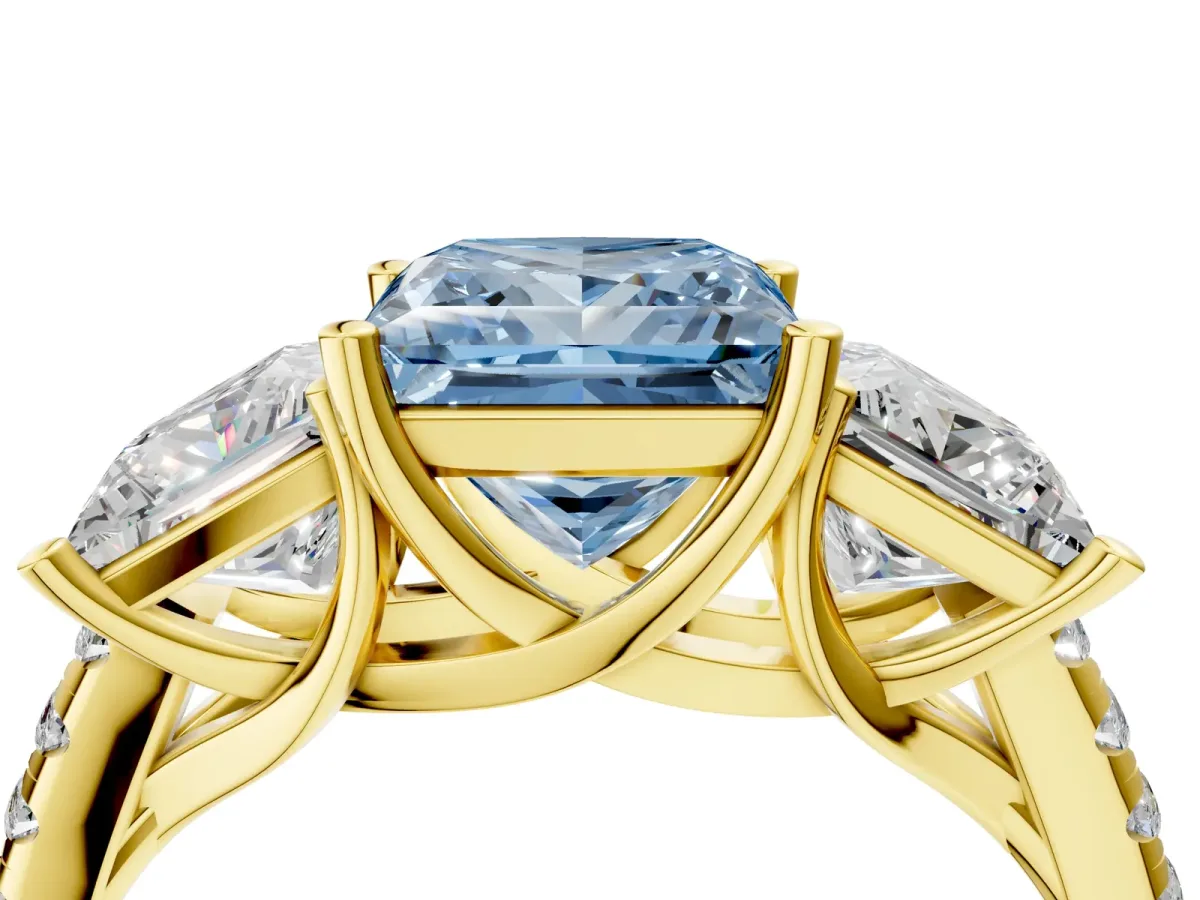 Fancy Blue Three-Stone Princess Cut Diamond Ring with Round Pavé Band and Prong Setting Yellow gold