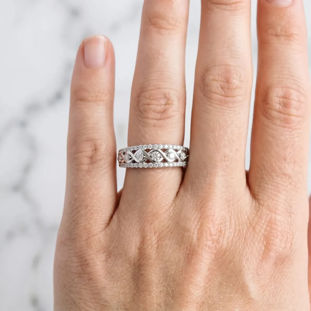 Round Brilliant Diamond Infinity Twist Pave Band with Prong Setting White gold