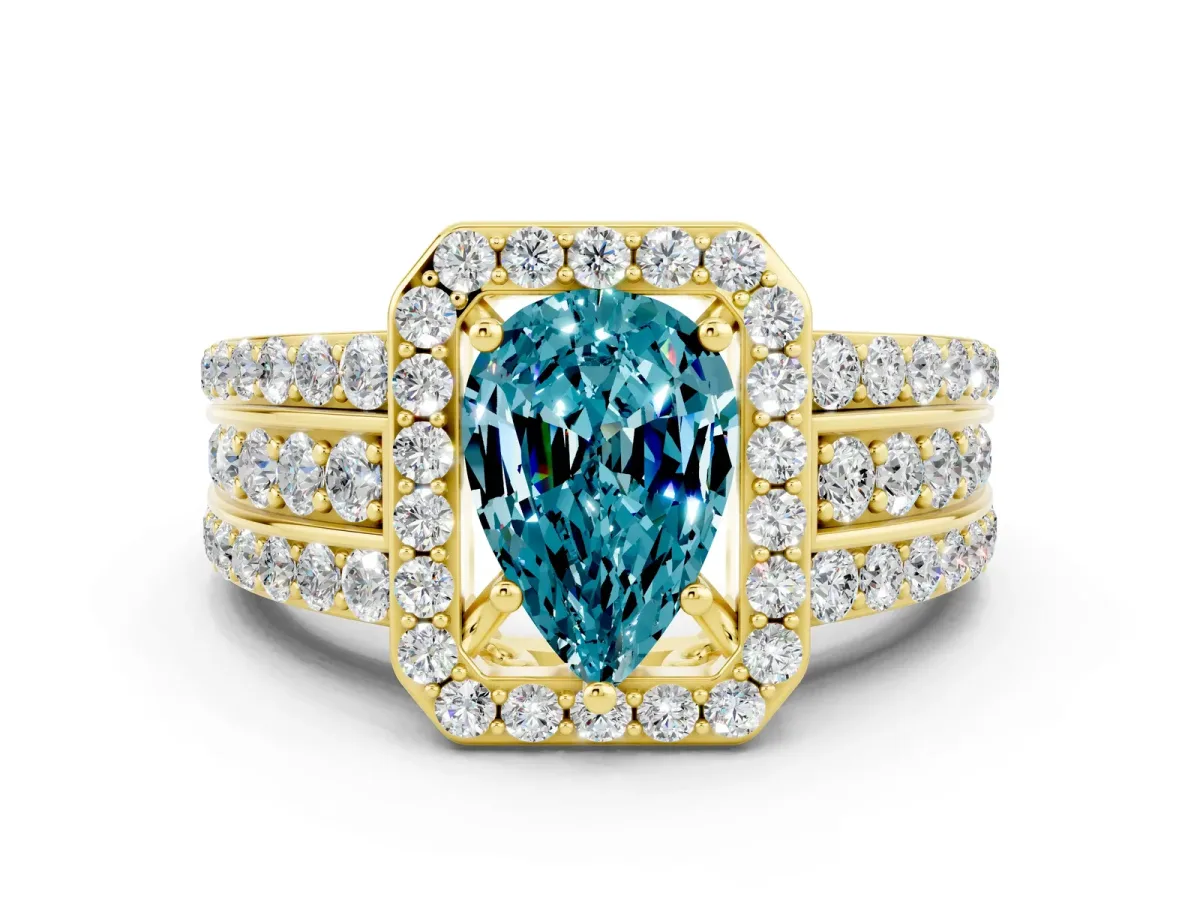 Pear Cut Halo Blue Topaz Ring with Round Split Shank and Prong Setting Yellow gold
