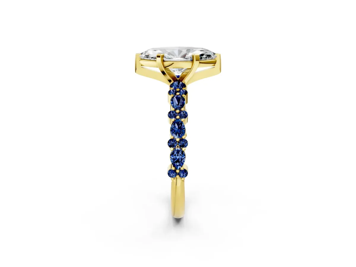 Marquise Cut Diamond Side Stone Solitaire Ring with Round Blue Sapphire and Four-Prong Setting Yellow gold