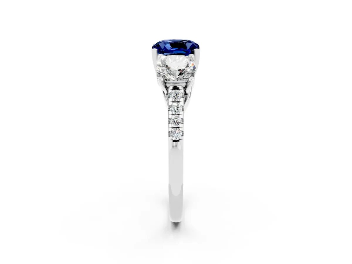 Three-Stone Cushion Cut Blue Sapphire Ring with Round Pavé Band and Prong Setting Silver