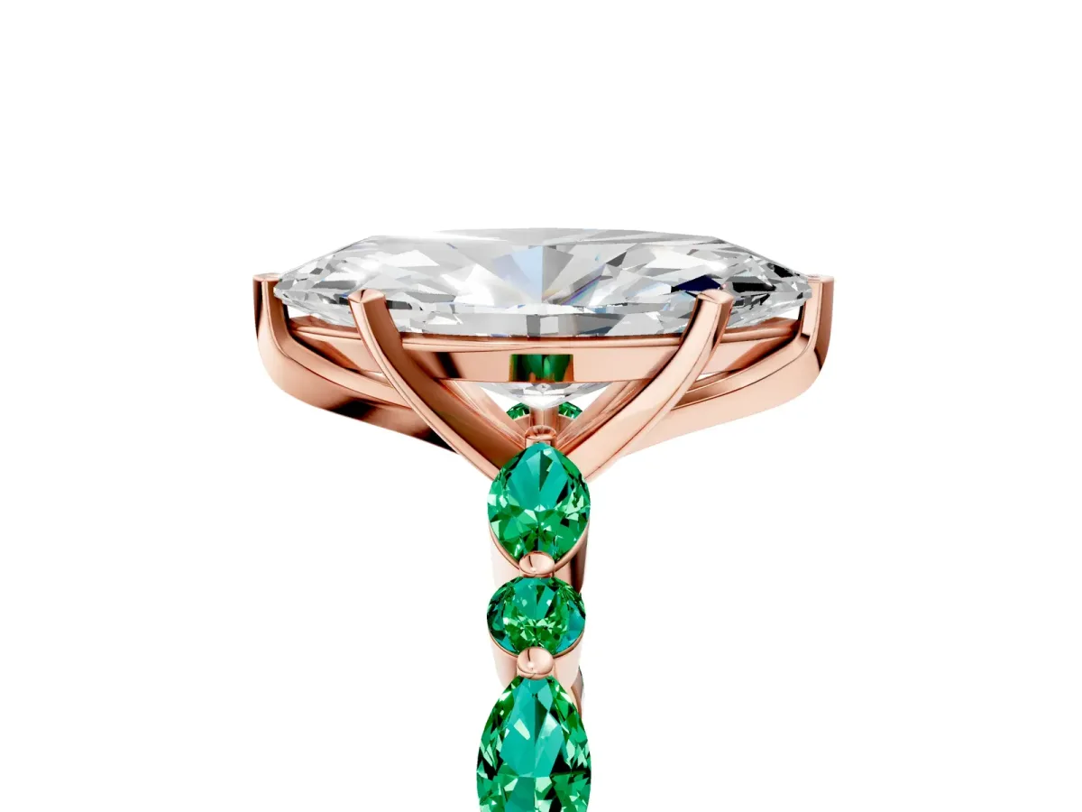 Marquise Cut Diamond Ring with Marquise and Round Emerald Side Stones and Four-Prong Setting Rose gold