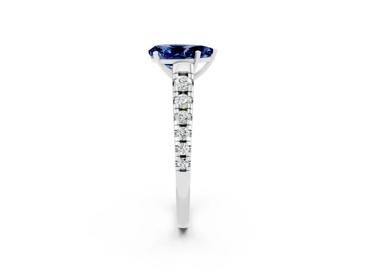 Pear Cut Blue Sapphire Cathedral Solitaire Ring with Round Pavé Band White gold