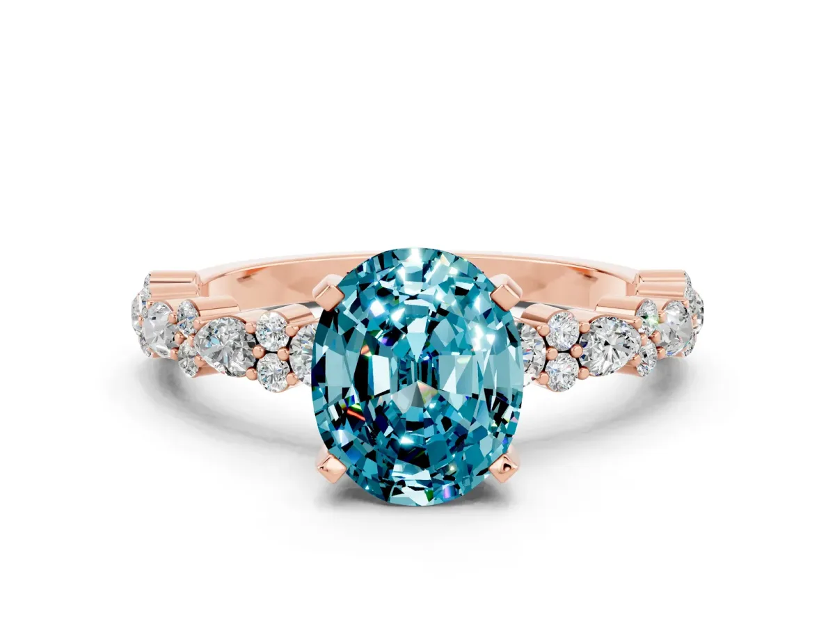 Oval Cut Blue Topaz Side Stone Solitaire Ring with Round and Four-Prong Setting Rose gold