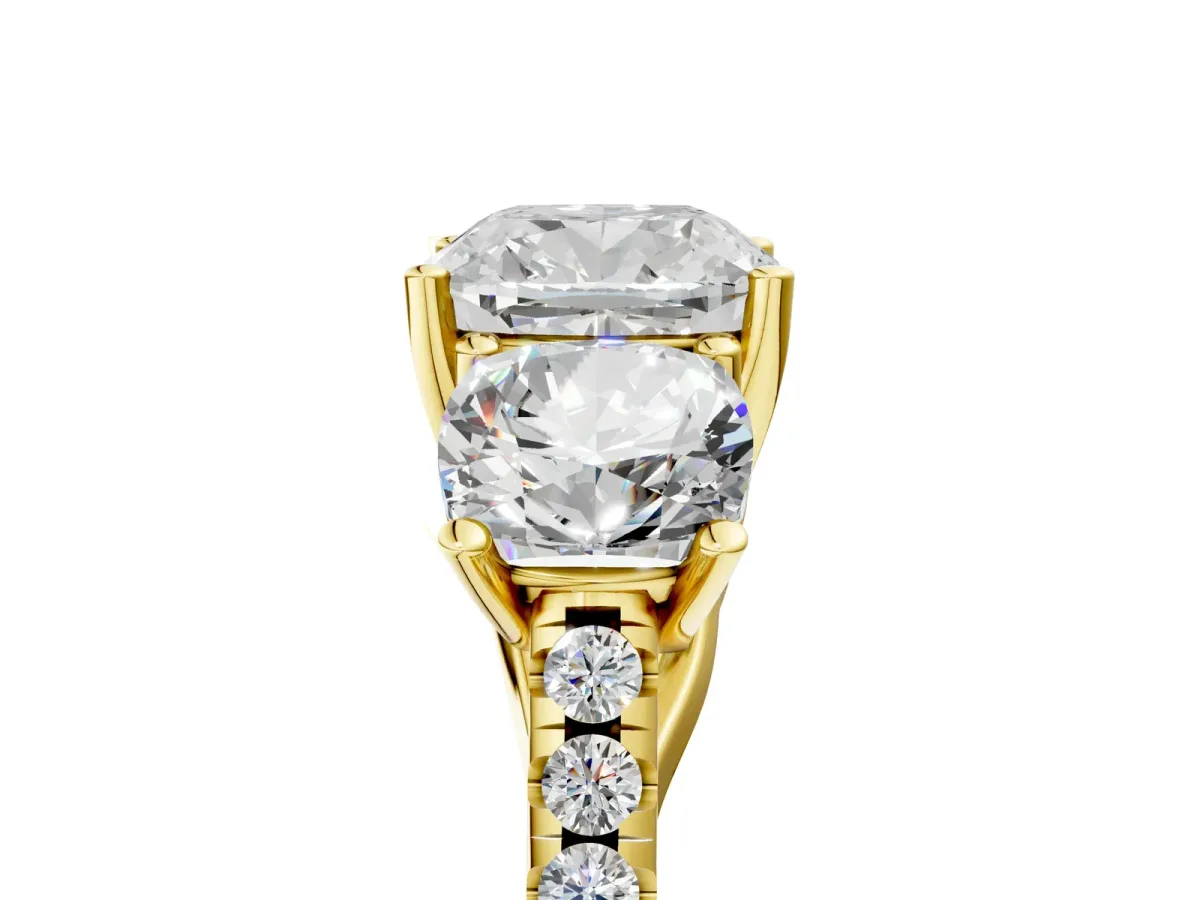 Fancy Black Three-Stone Cushion Cut Diamond Ring with Round Pavé Band and Prong Setting Yellow gold