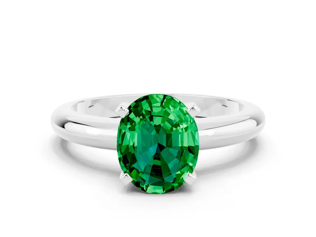 Oval Cut Emerald Solitaire Engagement Ring with Round Band and Four-Prong Setting Platinum