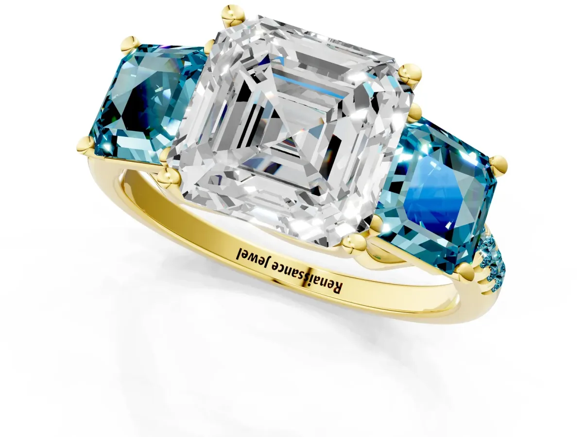 Three-Stone Asscher Cut Diamond Ring with Round Blue Topaz Pavé Band and Prong Setting Yellow gold