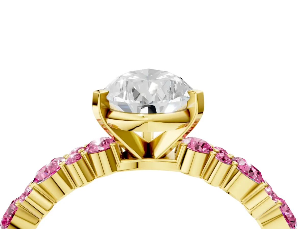 Pear Cut Diamond Side Stone Solitaire Ring with Round Pink Sapphire and Four-Prong Setting Yellow gold