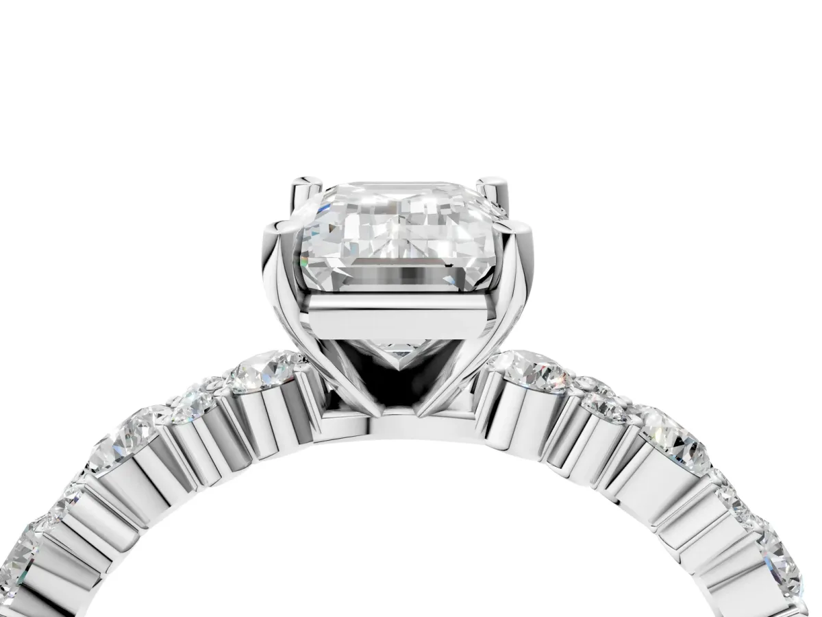 Emerald Cut Diamond Side Stone Solitaire Ring with Round and Four-Prong Setting White gold