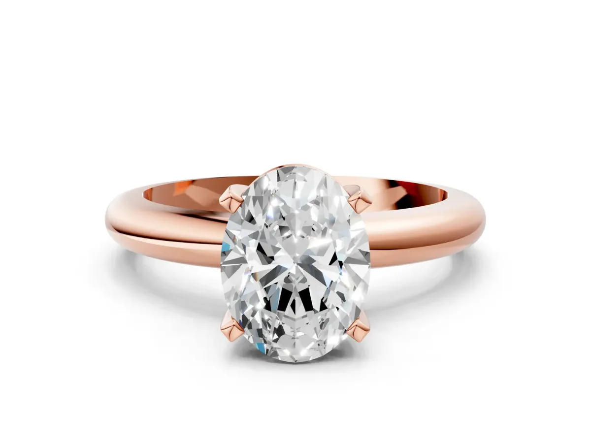 Oval Cut Diamond Solitaire Engagement Ring with Round Band and Four-Prong Setting Rose gold