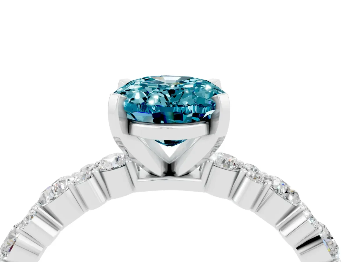 Oval Cut Blue Topaz Side Stone Solitaire Ring with Round and Four-Prong Setting Silver
