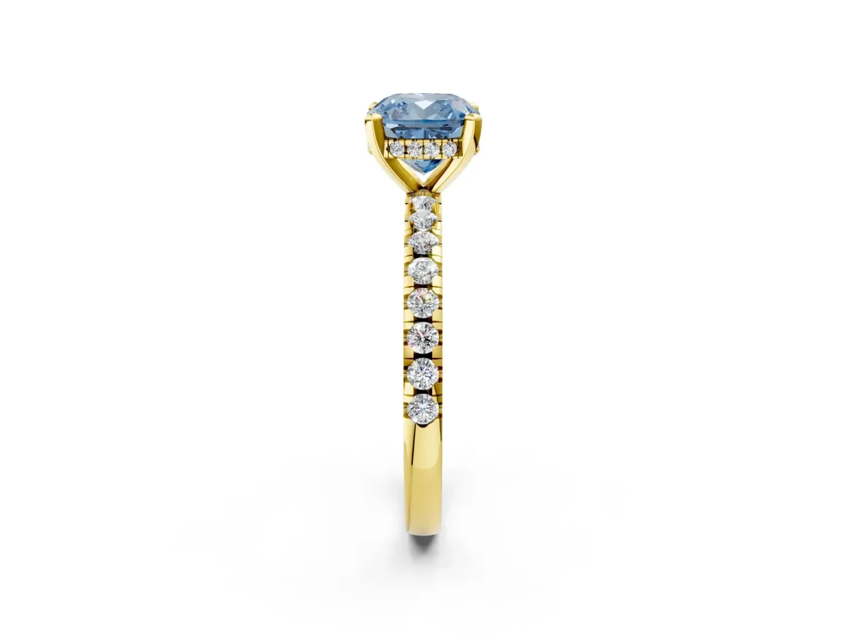 Fancy Blue Cushion Cut Diamond Solitaire Ring with Round Pavé Band and Four-Prong Setting Yellow gold